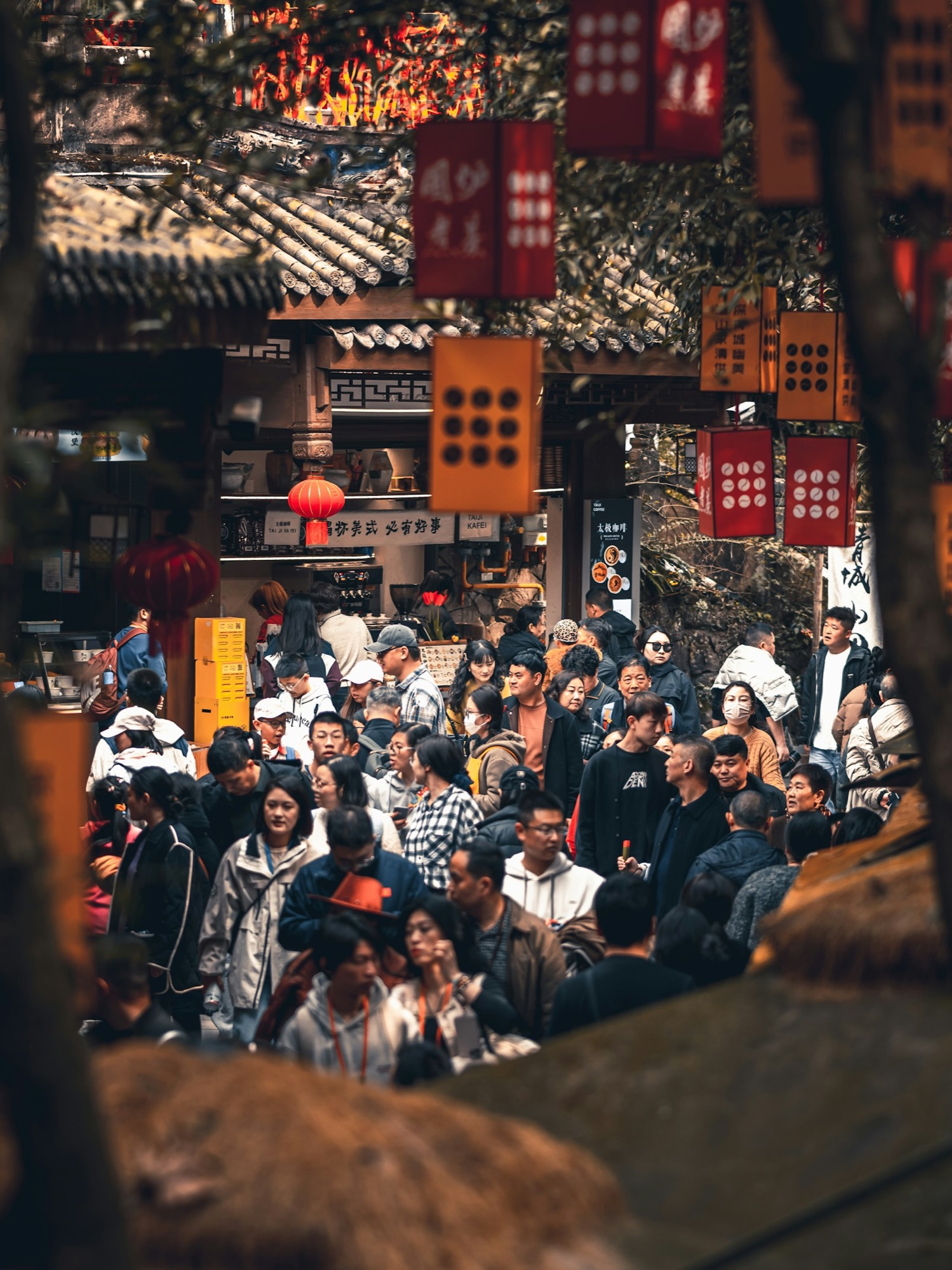 A busy Chengdu market street decorated with lanterns