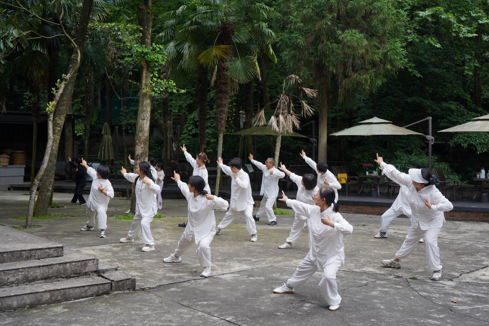 A group practising tendon-relaxing movement